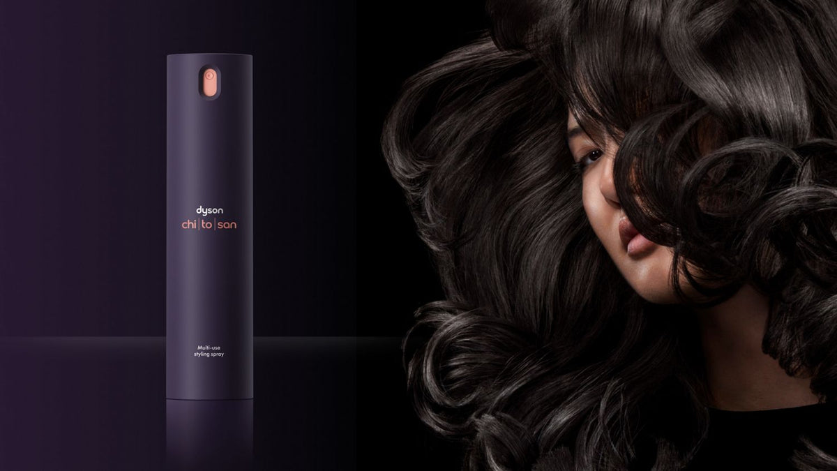 Dyson Chitosan Multi-use styling spray and a model with shiny black hair styled with Dyson Chitosan products.