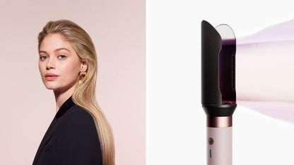 Model with long straight hair next to the Dyson Airwrap Co-anda2x multi-styler and dryer.