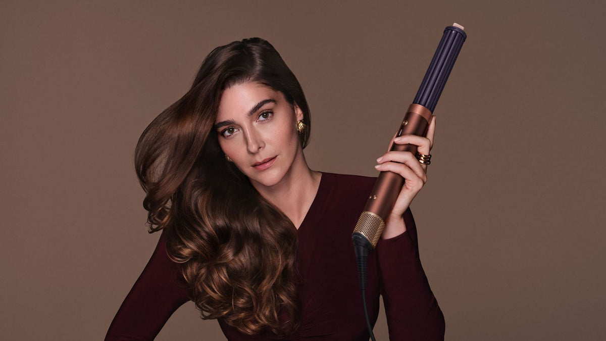 Model shows off hair styled with the Dyson Airwrap Co-anda2x multi-styler and dryer.