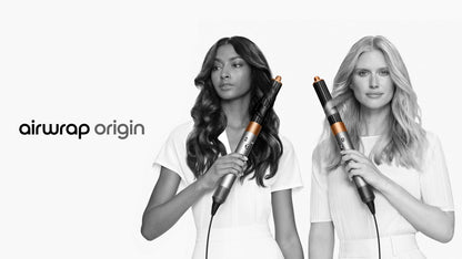 Two models with different hair types style their hair with the Dyson Airwrap multi-styler and dryer.