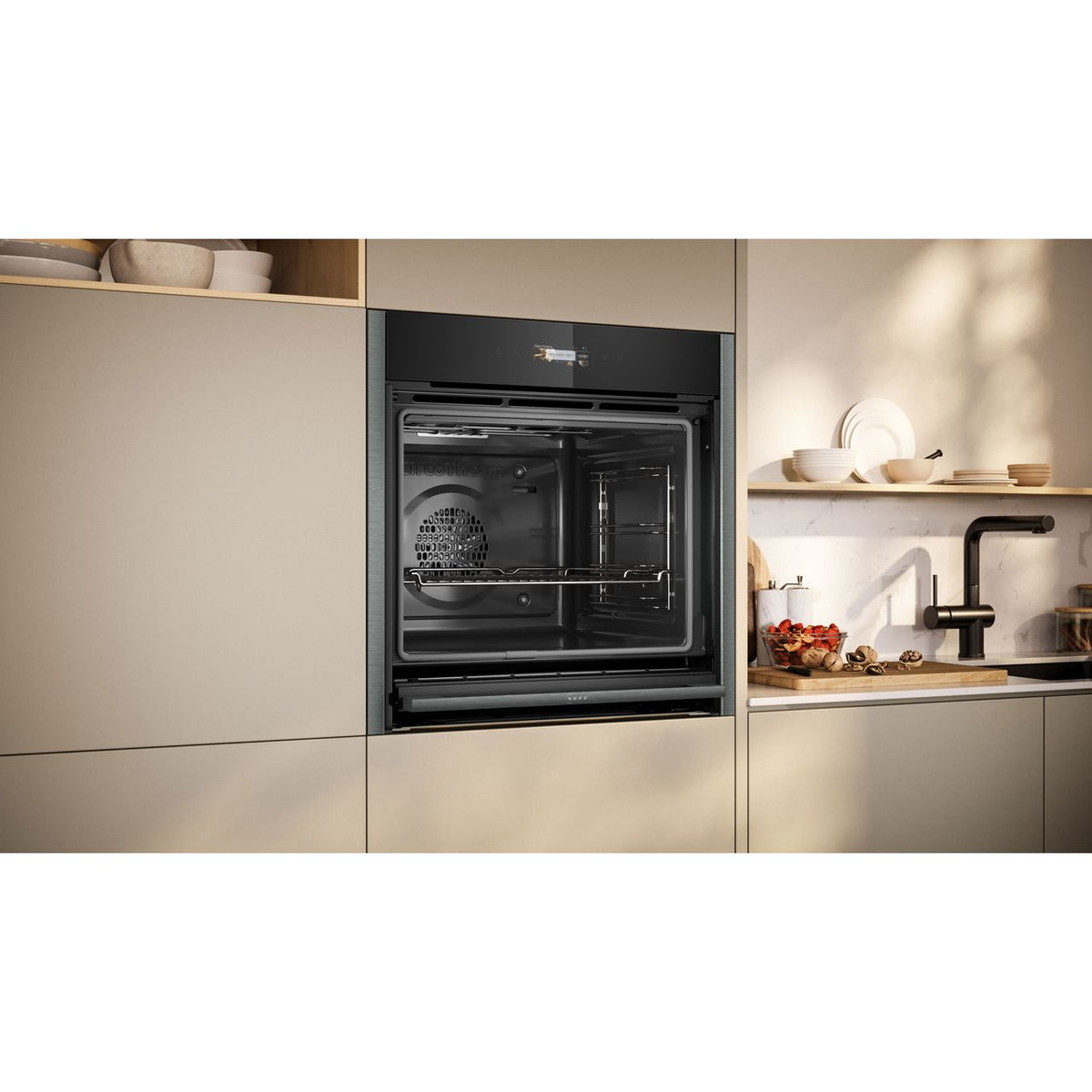 NEFF N70 Slide & Hide® Built In Electric Single Oven - Graphite -  Oven in kitchen door open shot