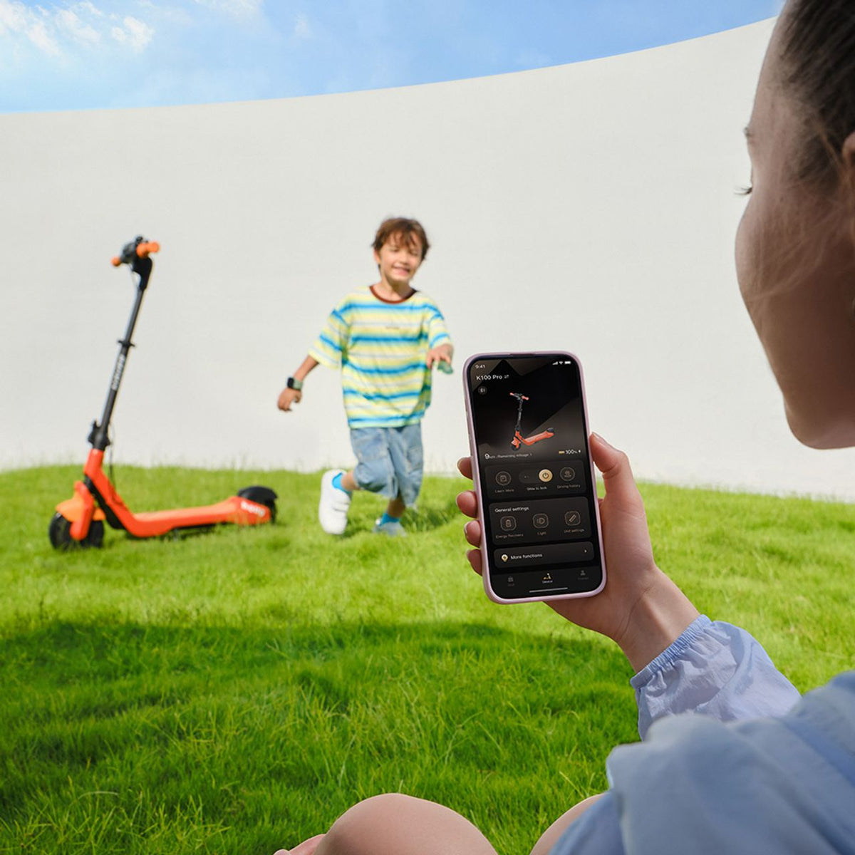 Navee Electric Scooter - Woman looking at app