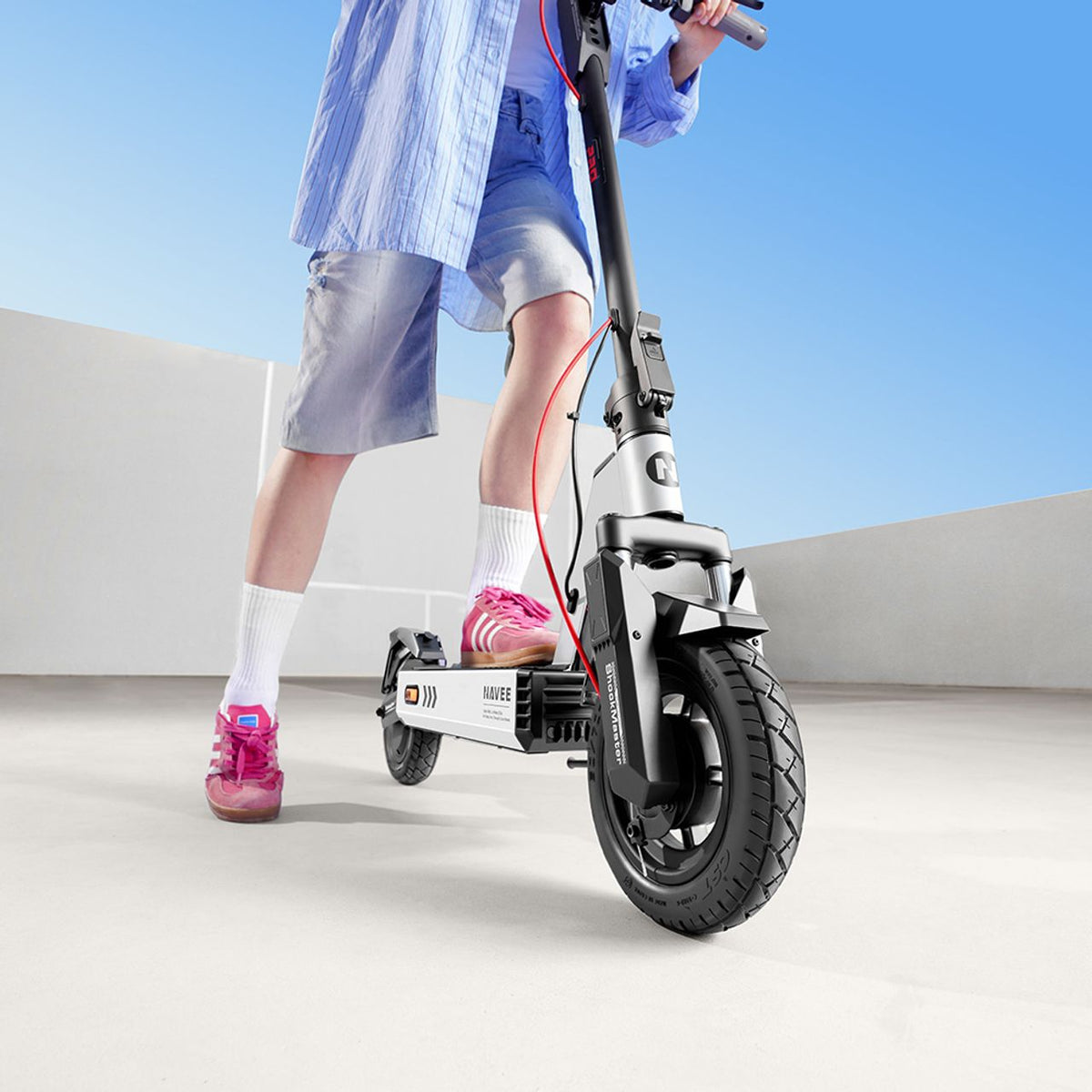 Navee Electric Scooter - Person riding scooter