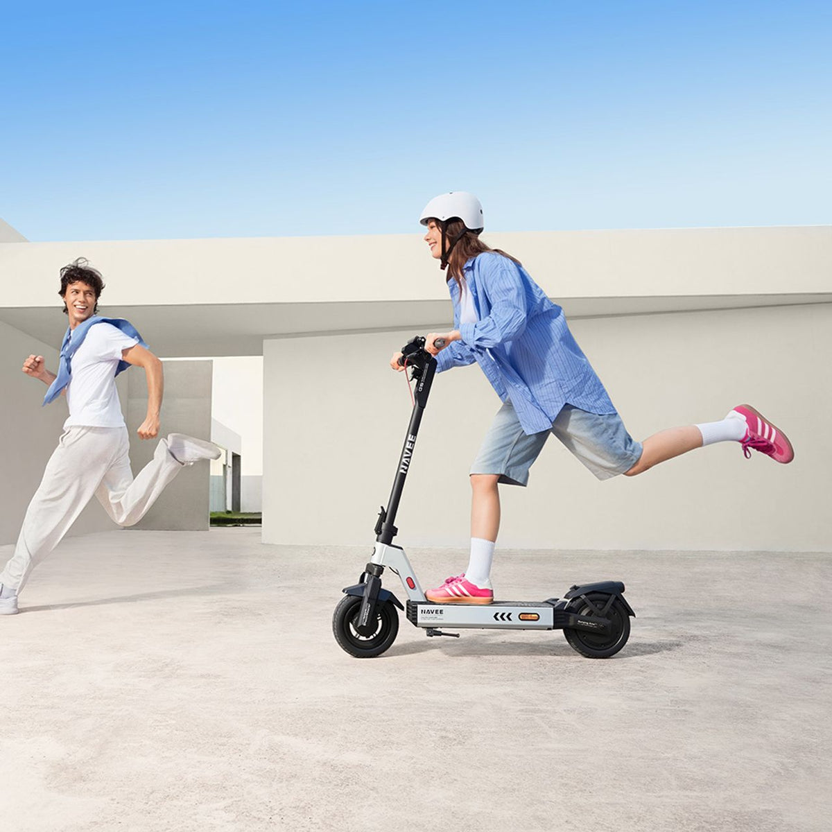 Navee Electric Scooter - Woman riding scooter